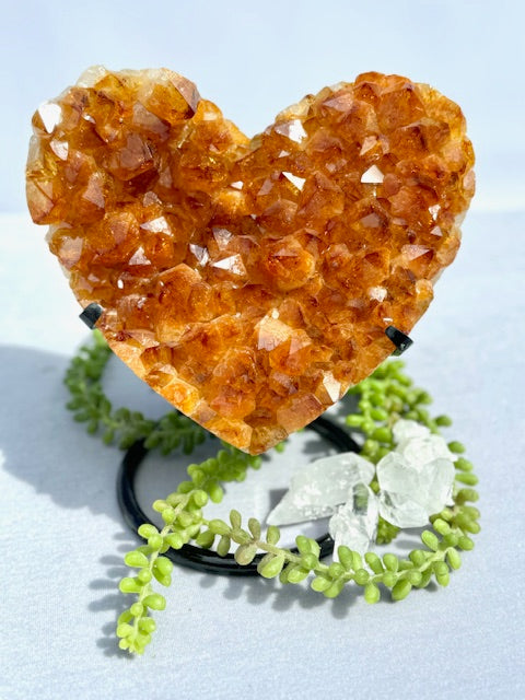 Luminous Affection: Heart-Shaped Citrine Geode on Display Stand