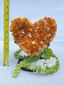 Luminous Affection: Heart-Shaped Citrine Geode on Display Stand